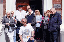 The Master centre being greeted by a welcoming party at the end of his 110 mile Grand Union Canal Walk