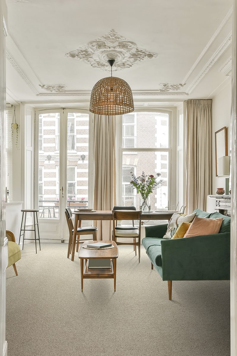 The rich interior of the living room of a modern house combined with a dining area